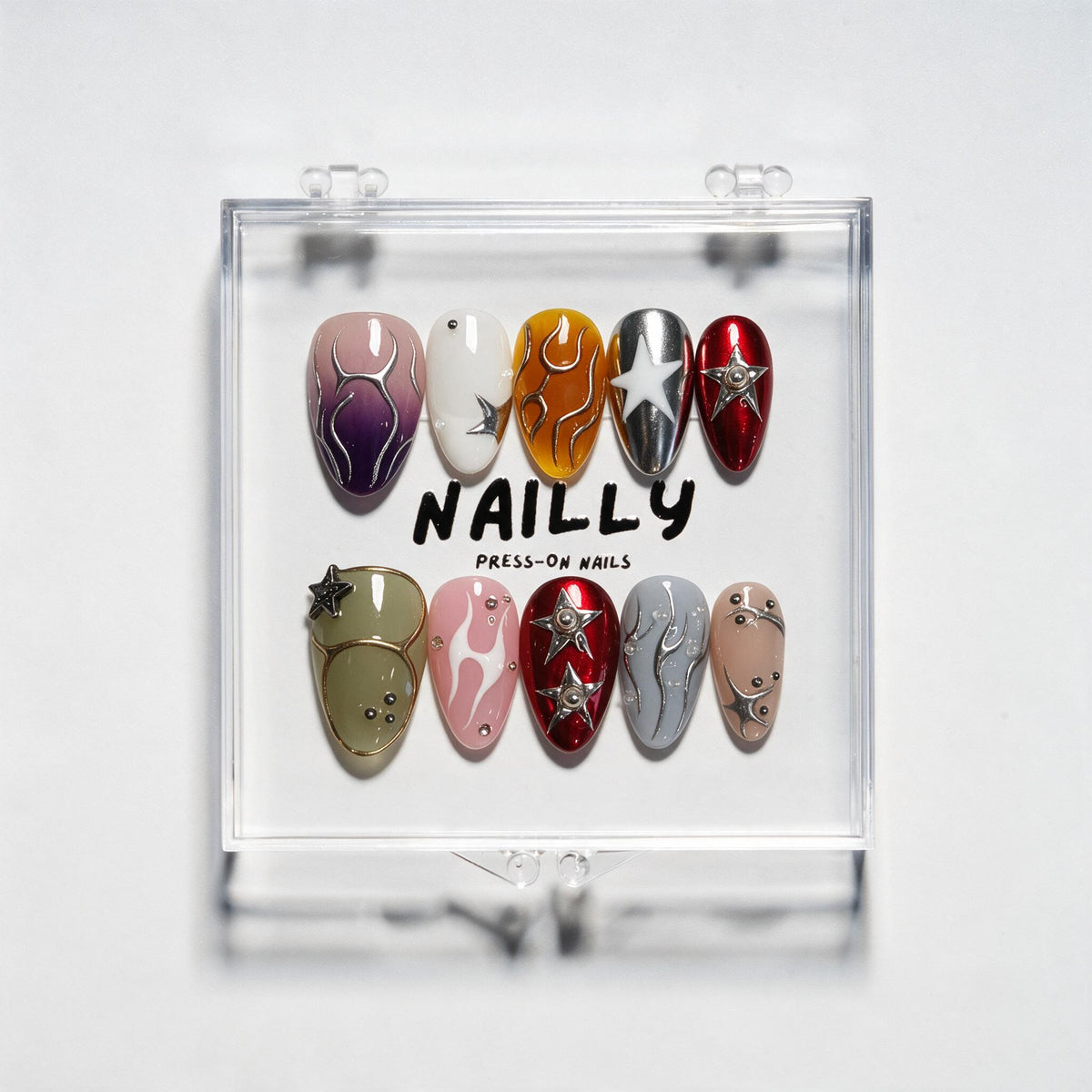 Awakening short almond press-on nails in plum, amber, red, olive, pink and blue with star motifs, chrome and silver linework