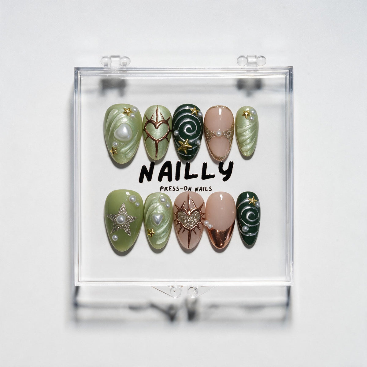 Reverie short almond press-on nails in sage and forest green with heart, star, metallic, glitter and pearl details